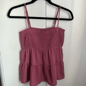 Adorable summer top with thin straps and a fitted look